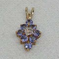 9YG 0.6G OVAL TANZ & DIAMOND SET PENDANT - PRE OWNED