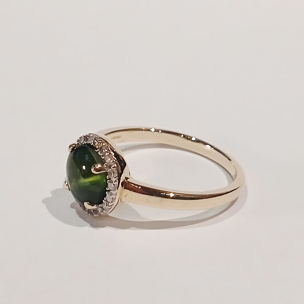 9YG GREEN CABOCHON & DIAMOND CLAW SET HALO RING