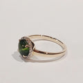 9YG GREEN CABOCHON & DIAMOND CLAW SET HALO RING