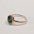 9YG GREEN CABOCHON & DIAMOND CLAW SET HALO RING