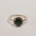 9YG GREEN CABOCHON & DIAMOND CLAW SET HALO RING
