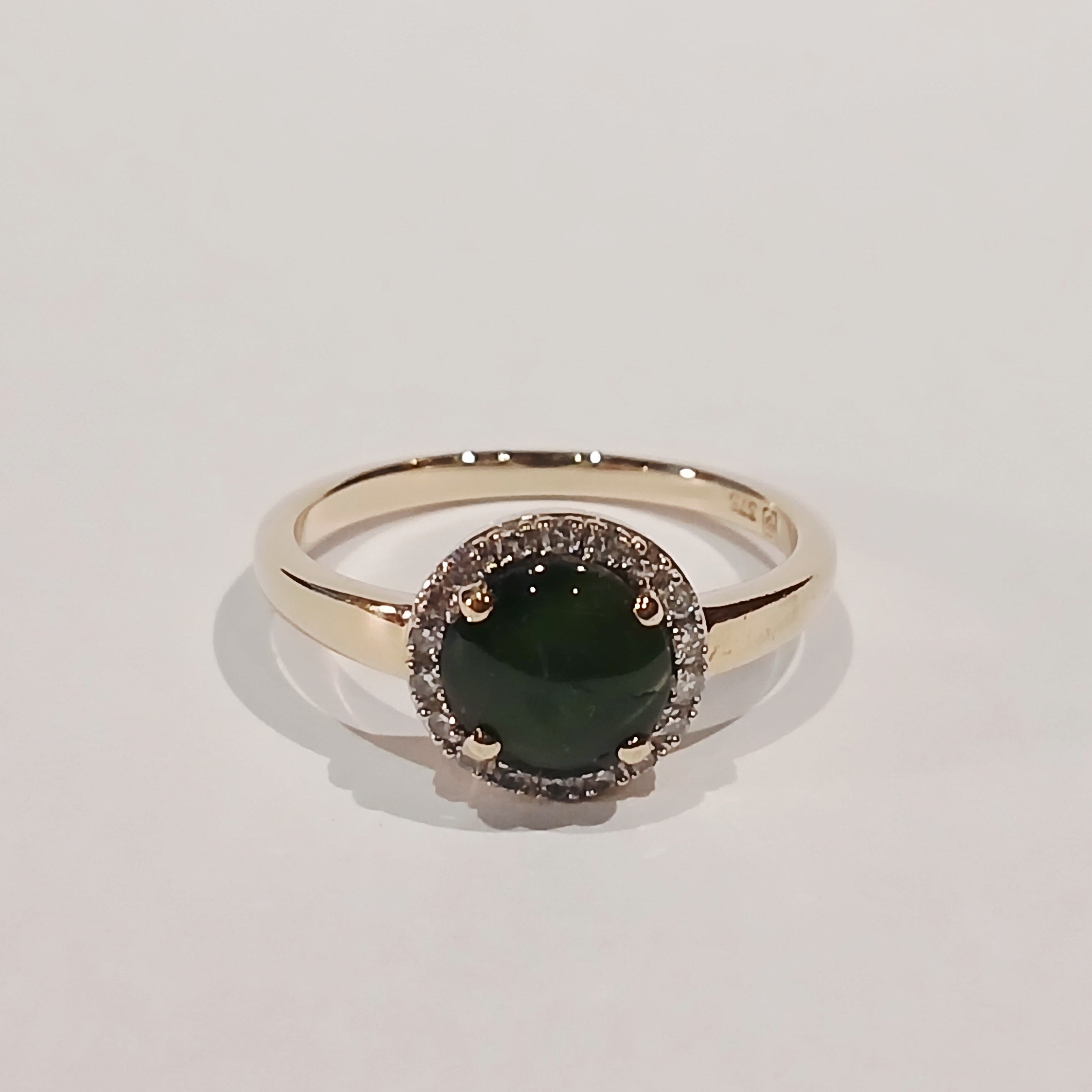 9YG GREEN CABOCHON & DIAMOND CLAW SET HALO RING