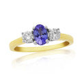 9CT YG OVAL TANZANITE & 2 DIAMOND CLAW SET RING
