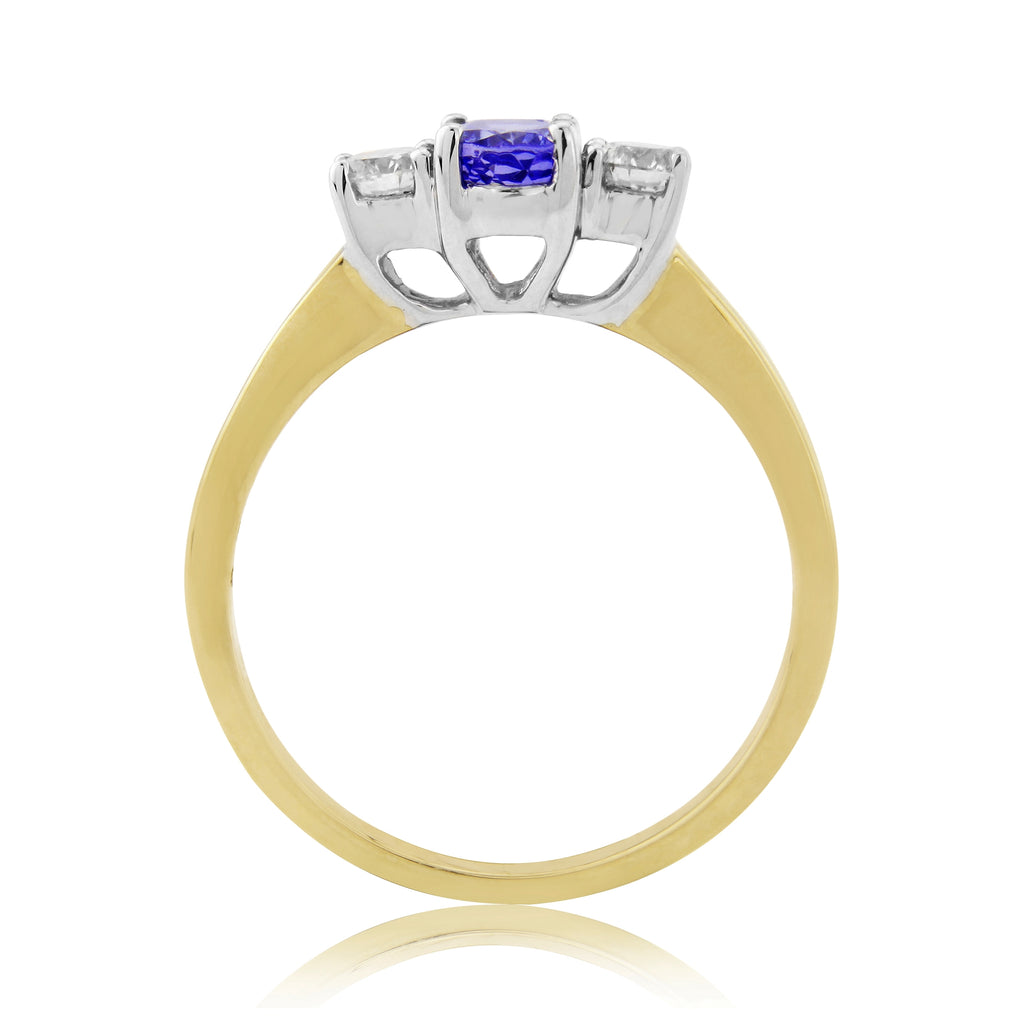 9CT YG OVAL TANZANITE & 2 DIAMOND CLAW SET RING
