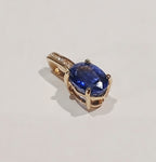 9YG 0.6G OVAL TANZ & DIAMOND SET PENDANT - PRE OWNED