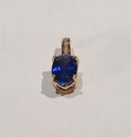 9YG 0.6G OVAL TANZ & DIAMOND SET PENDANT - PRE OWNED